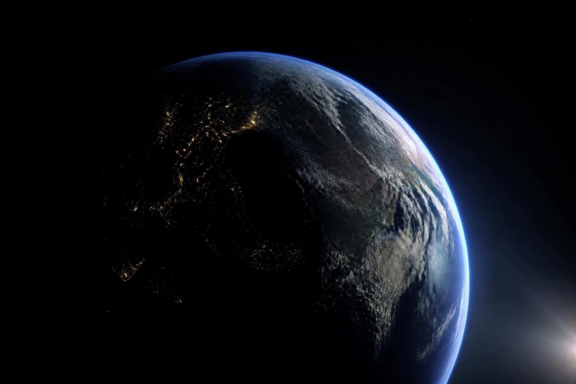 Planet Earth seen from space, lit along its edge by the sun